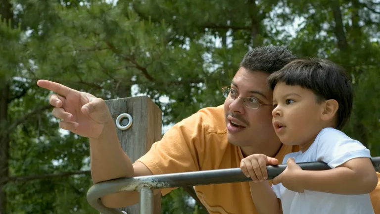 The kind of teaching God commands requires much more than a once-a-week session at church services. It must be a regular practice, all week long. Such teaching should become a way of life. A dad and son playing at a park.
