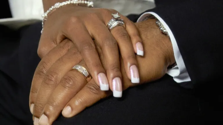 When two people exchange wedding vows, they make a lifelong commitment. Biblically speaking, this is a covenant—a solemn promise to God and one’s mate to be faithful. A couple holding hands showing their wedding rings.