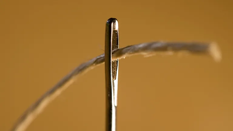 Just as it is impossible for a camel to go through the tiny eye of a needle, it is equally impossible for those who trust in riches, instead of in God, to enter the Kingdom of God. A thread going through the eye of a needle.