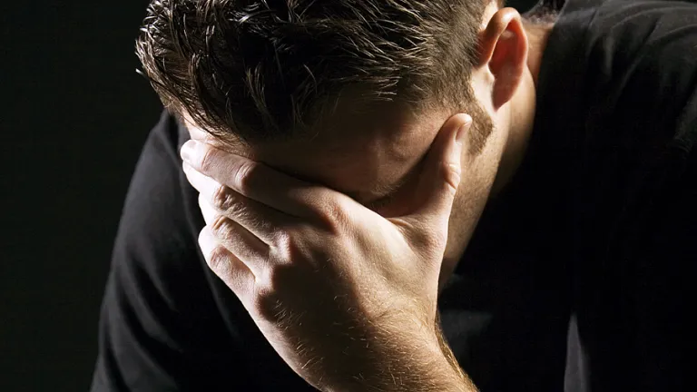 The Bible describes repentance as a profound realization of our sins and resulting sorrow that leads us to change our thoughts and actions. A young man holding his head with hands as in sorrow or remorse.