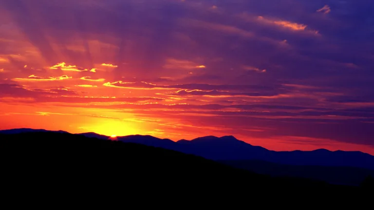 God, Creator of the Sabbath, determines when the day begins and ends, and it was observed from sunset to sunset throughout the Bible. A sunset over a mountain ridge.