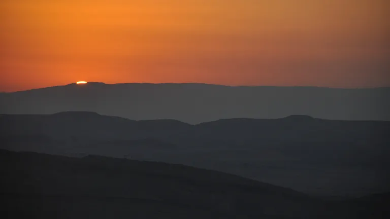 Jacob must have thought about the stories he had heard while growing up about his family’s encounters with this awesome, divine being. Sunset over desert hills.