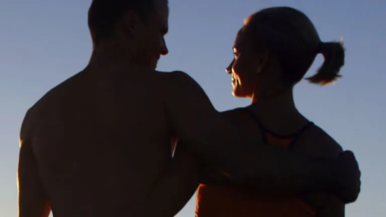 A man and woman standing beside each other.