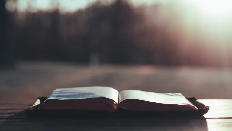 An open Bible on a table.
