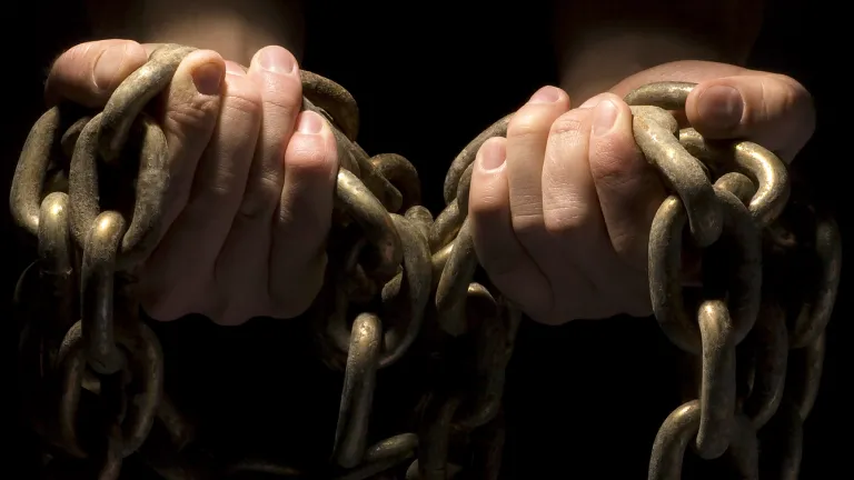 Sin is like a trap; lawlessness is a snare. It may look harmless until the consequences begin to appear. Then the sinner is trapped, ensnared by his own foolishness. Hands hold heavy chains.