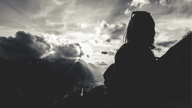 Is the Kingdom of God something that exists only in the hearts and minds of believers? Woman with sun rays in background.