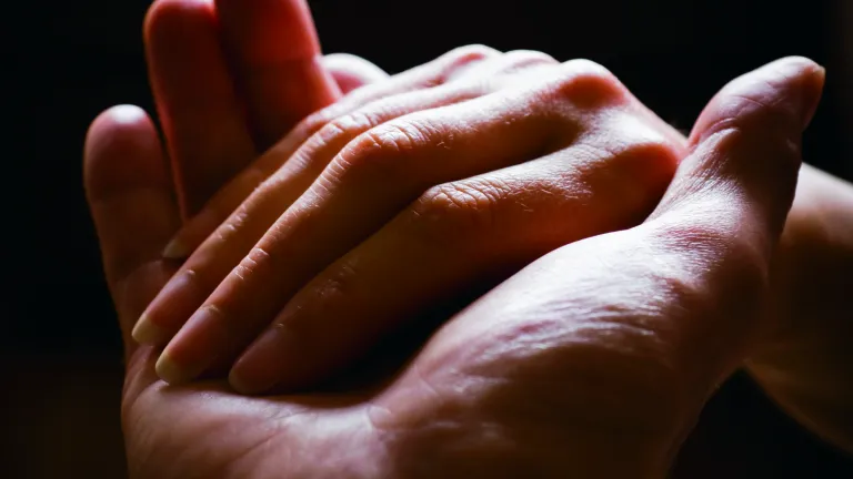 A hand helping another hand.