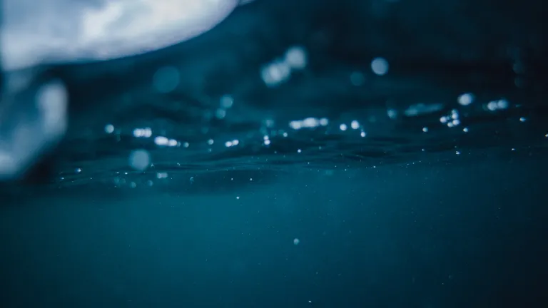 Once a mature person has spiritual understanding and faith and has repented of his sins, he should not delay baptism. Looking up through water at the sky.