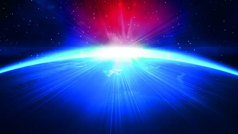 Sun coming over the horizon the earth.