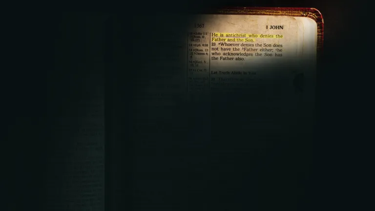 A Bible open to 1 John.