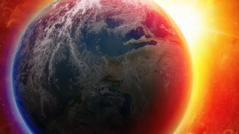 “For then there will be great tribulation, such as has not been since the beginning of the world until this time, no, nor ever shall be” (Matthew 24:21) The earth from space with a red/orange glow in the background.