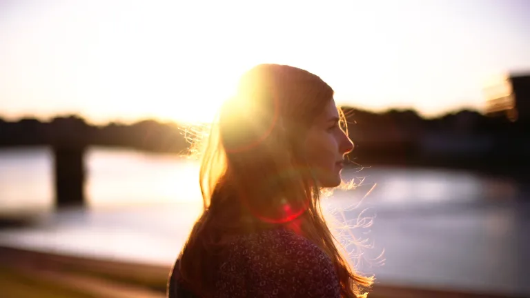 God is a miracle worker, and nothing you or I may go through is too great or big for Him to solve and fix. God is the healer of all the brokenhearted! A woman with the sun reflecting through her hair.