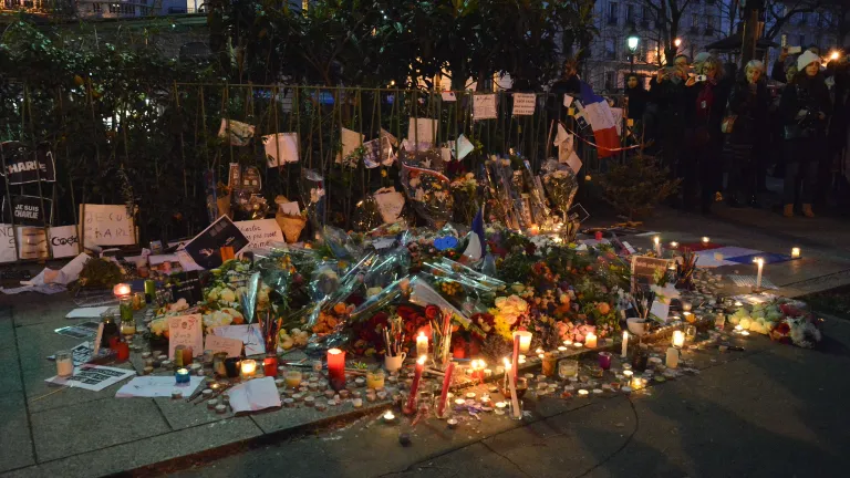 A memorial of candles to recent victim of terrorist act.