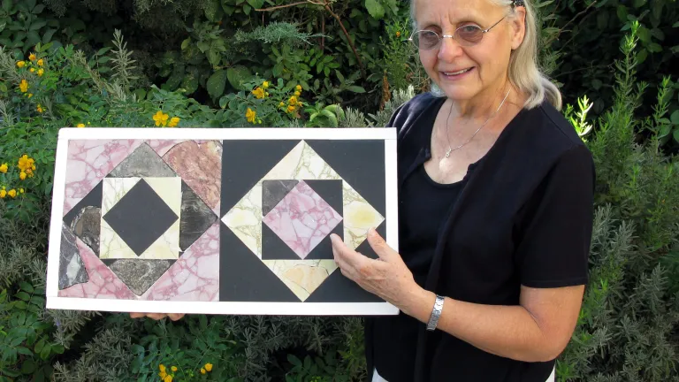 Temple Mount Sifting Project researcher Frankie Snyder shows some of the reassembled cut stone tile section patterns recovered from material illegally removed from Jerusalem's Temple Mount. Temple Mount Sifting Project researcher Frankie Snyder.