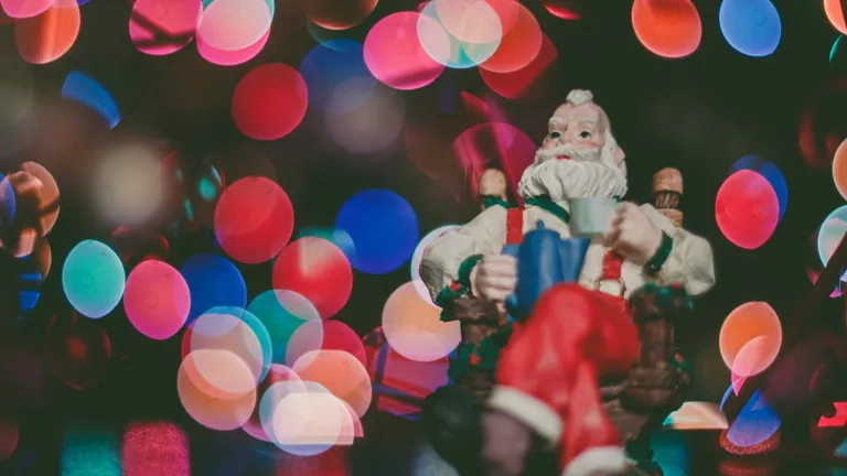 Anyone with access to the Internet can easily learn the origins of Christmas and its associated customs, such as the Christmas tree, Santa Claus, kissing under mistletoe and celebrating on Dec. 25. A Santa Claus ornament in a Christmas tree.