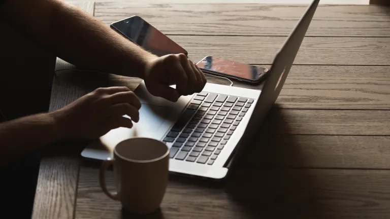 Here’s an important question for you: Can you truly worship the true living Christ during this season with all the trappings that surround the celebration of His birth? A person typing on a laptop.
