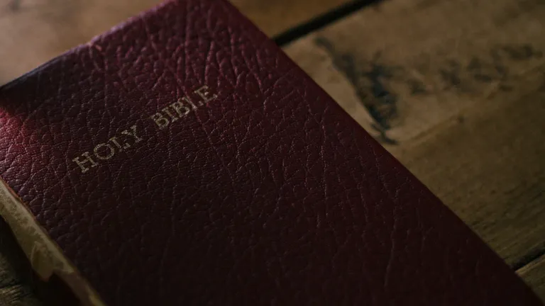 A Bible laying on a table.
