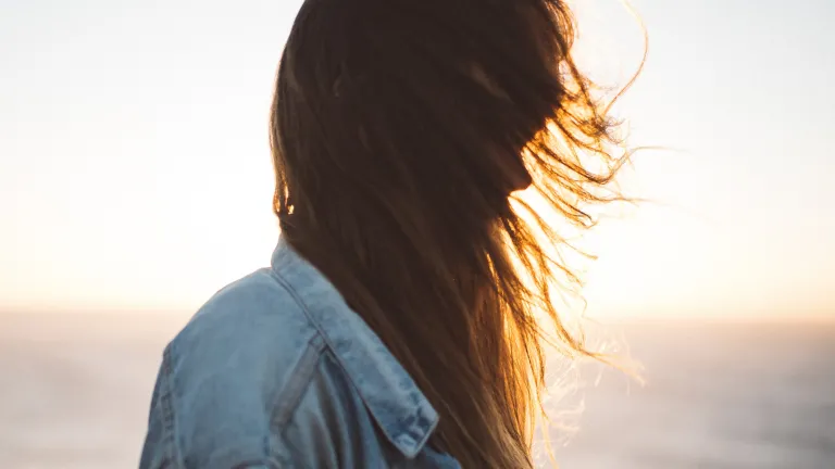 Broken spirits can be mended, but that healing is almost impossible without some help. Sun rays shining through a young woman's hair.