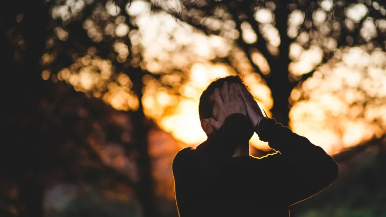 We don’t always understand why God does what He does—why some live and others do not. A man with his hands on his face looking up.