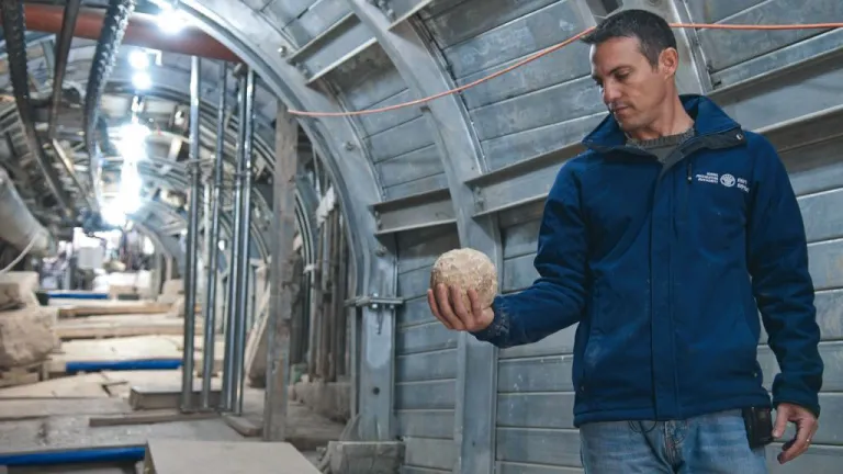 Archaeologist Nahshon Szanton holds a ballista stone apparently launched by Roman soldiers during the seige of Jerusalem in A.D. 70, found on an excavated first-century street. Archaeologist Nahshon Szanton holds a ballista stone apparently launched by Roman soldiers during the seige of Jerusalem in A.D. 70, found on an excavated first-century street.