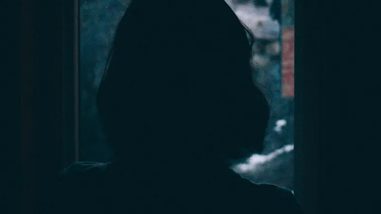God knows what happened to you. He offers you comfort now to be healed from your pain. And He has a plan to never let sexual assault happen again. A woman looking out a window.