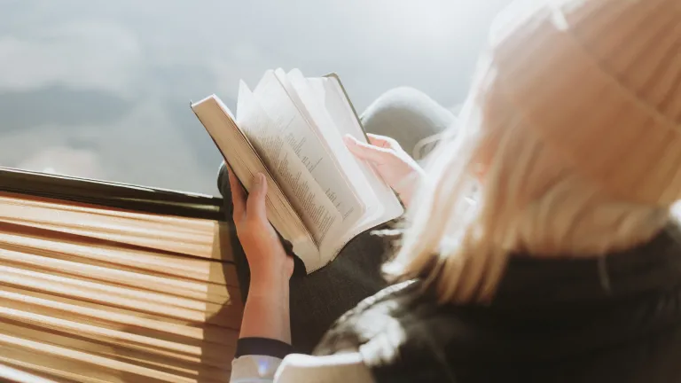 If you are feeling out of sync with God or with others, study God’s commandments. A woman reading a Bible.