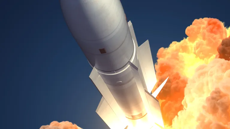A illustration of a missile flying in the sky.
