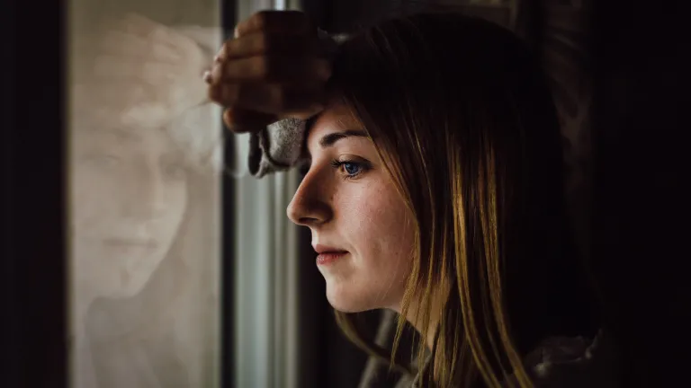 It is important not to allow evil into our lives in any form. If it does get in we must stop, realize what is happening and put an end to it at once—like with the bird pecking at my window. A woman looking out a window.