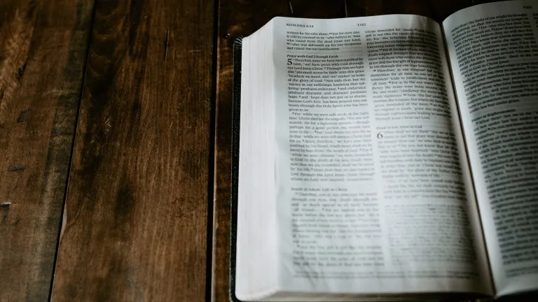 After the first few verses of Romans 6, Paul goes into a detailed discussion of two ways of life. A Bible opened to the book of Romans
