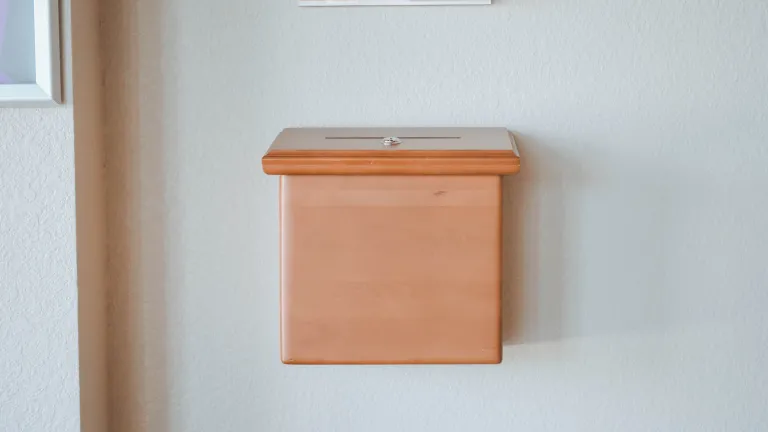 Offerings can also be made spontaneously at any time as an act of worship when a person feels moved to do so, but this is separate from the commanded yearly offerings. A box attached to the wall where one could drop in money at a church.