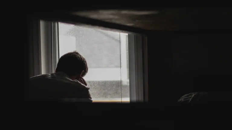 At your most discouraged moments, ask God to encourage you. It works! A man looking out a window.