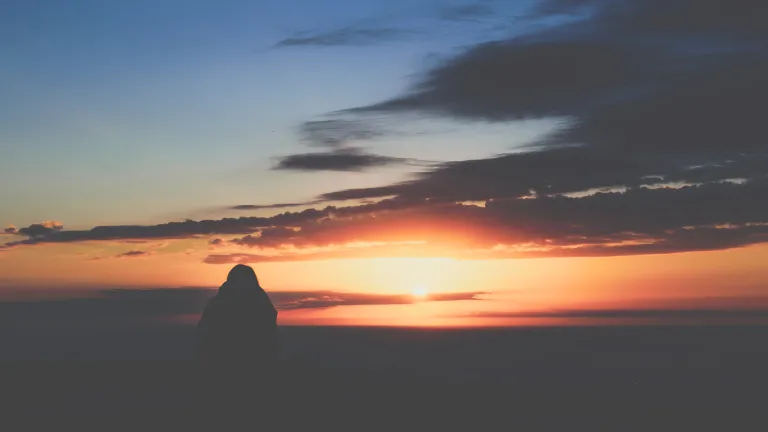 As we recall what Jesus did for us in His great sacrifice, let’s also remember why—for the future He will bring for us all. For a transformed world. A person watching the sunset.