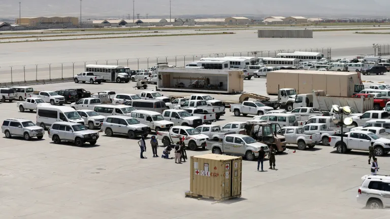 Afghan soldiers inspect some of the thousands of U.S. vehicles abandoned in the American pullout from Bagram Air Base, Afghanistan, in July 2021. Afghan soldiers inspect some of the thousands of U.S. vehicles abandoned in the American pullout from Bagram Air Base, Afghanistan, in July 2021.
