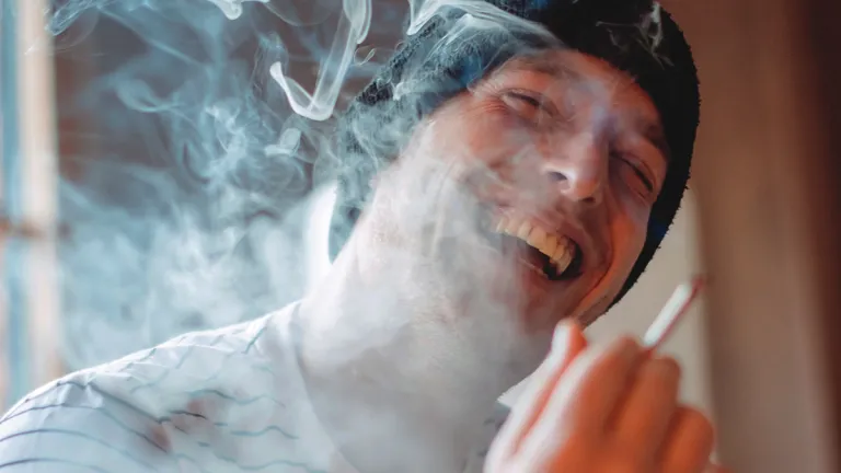 A man smoking.