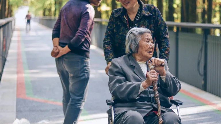 Service doesn’t need to be grandiose or flashy. Scripture often says small things result in great things! a woman pushing an older woman in a wheelchair while another woman watches