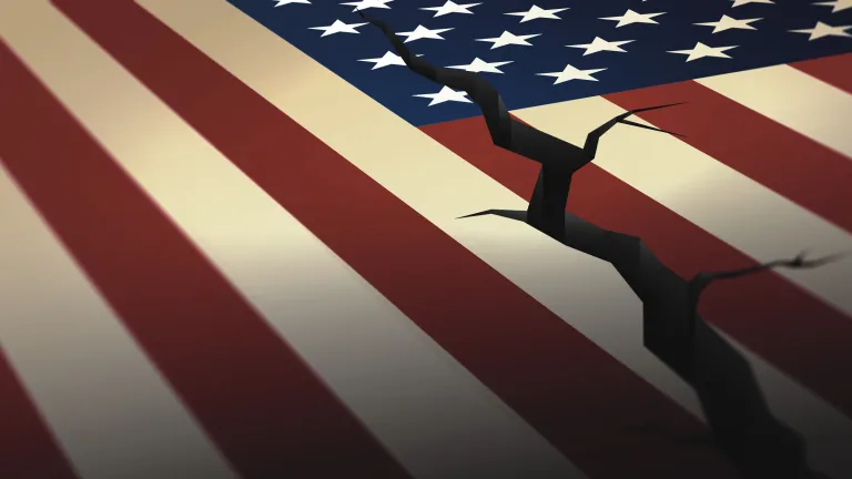 We have a picture of a nation in severe distress. America seems to be on a volcanic fault line waiting for something to explode. A artist illustration of a crack going through the American flag.