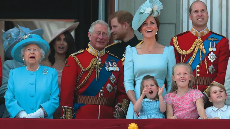 Four generations of Britain’s royal family watch a military flyover at Buckingham Palace. Four generations of Britain’s royal family watch a military flyover at Buckingham Palace.