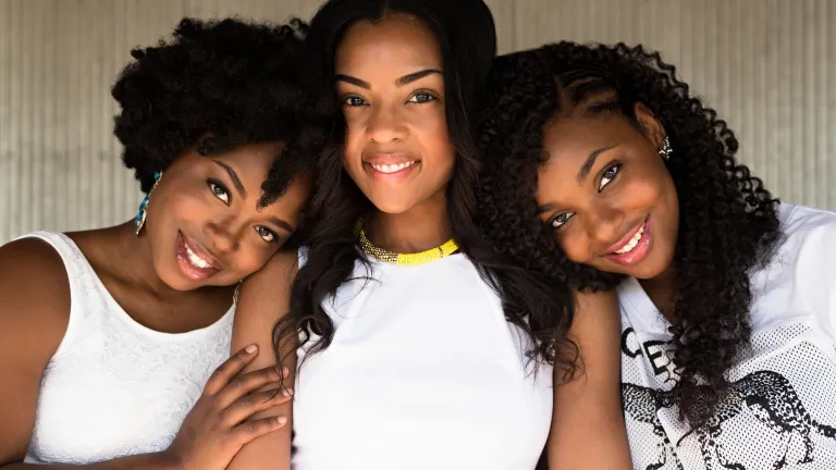 We can better fulfill our role as women by strengthening each other. three women smiling