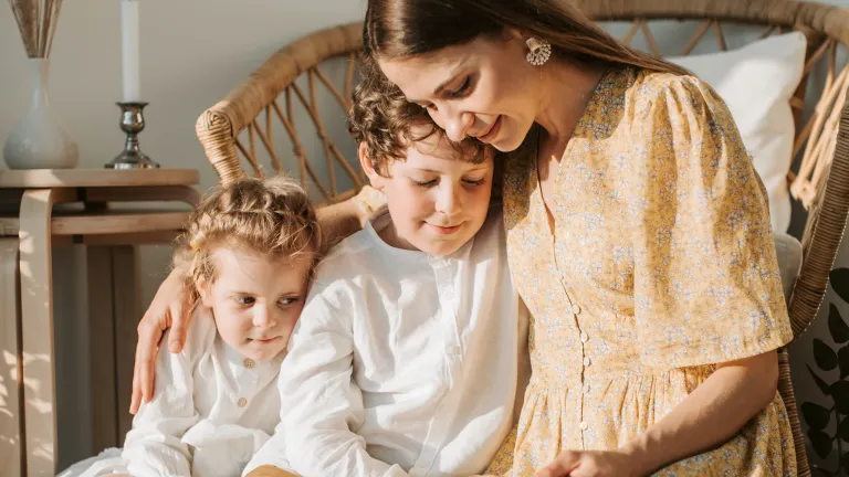 God wants the Sabbath to be a delight. a woman reading to two children