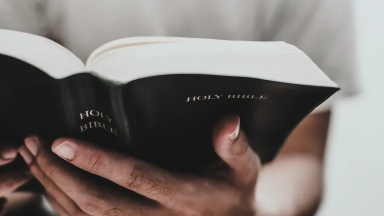 When people read the Bible with an open heart and mind, they come to see that the feasts and Sabbaths of the Lord have purpose and meaning for them! An upclose photo of a man's hands holding a Bible.