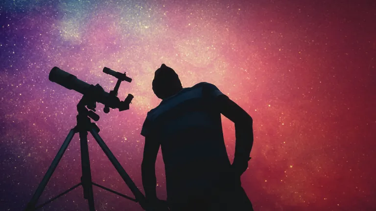 A person looking up a the night sky.