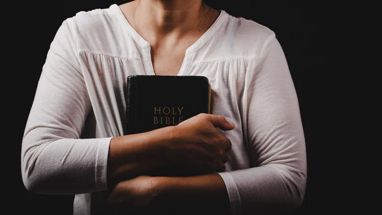 True peace of mind is not based on circumstances. We can find it even in the most difficult times. A woman holding a Bible.