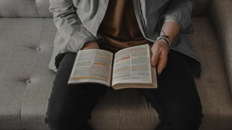 This is a time to wait and watch with patient endurance. A man reading a Bible.