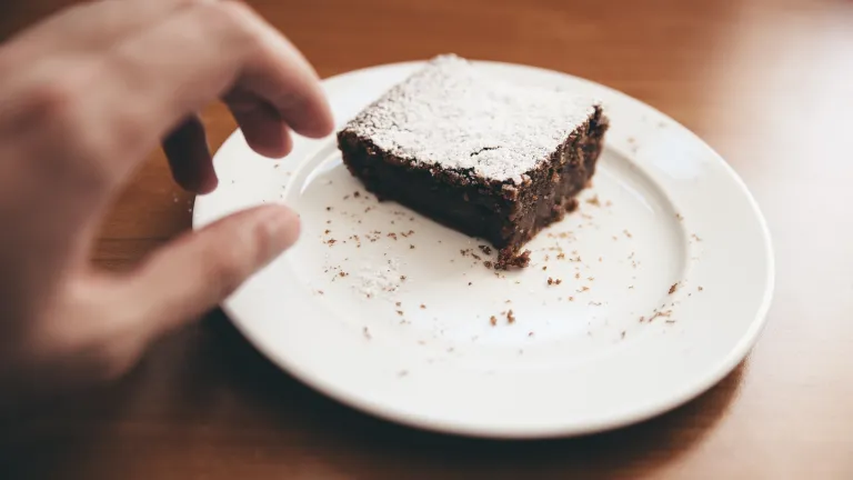 At the first hint of being tempted, immediately cry out to God! a hand reaching for a brownie on a plate