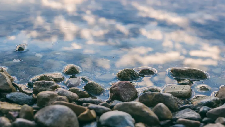 a surface of gray stones slightly covered with water