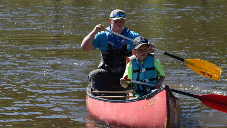 Camp Colorado two boys in a canoe