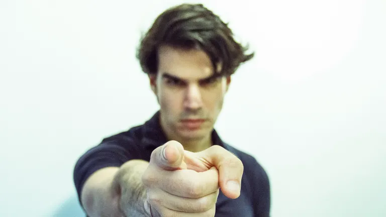When we are wronged, the urge to retaliate is tempting. a man pointing his index finger