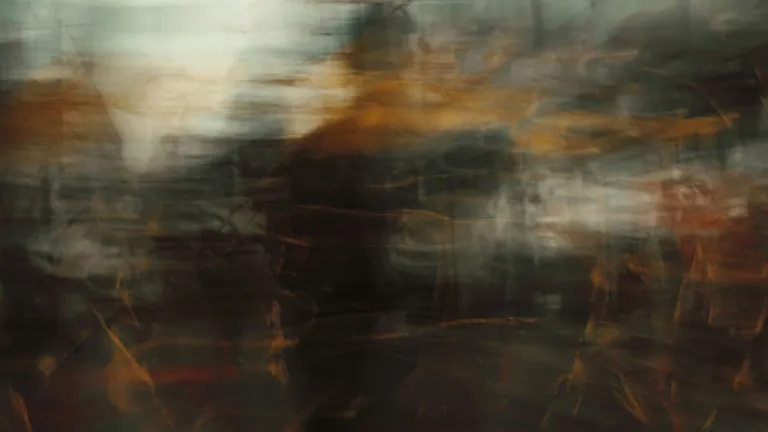 a blurry man in an abstract setting