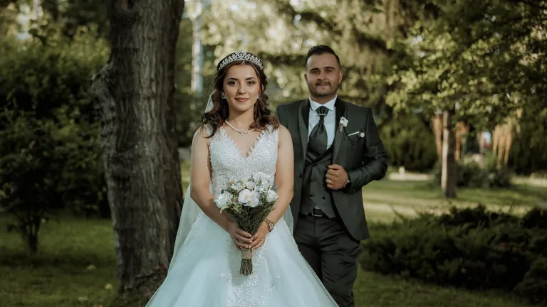 a bride and a groom walking outside