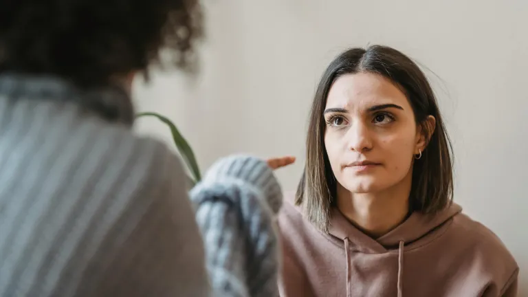 What are your options when a friendship has turned "toxic?" two women seated across from one another with one pointing a finger and the other teary-eyed